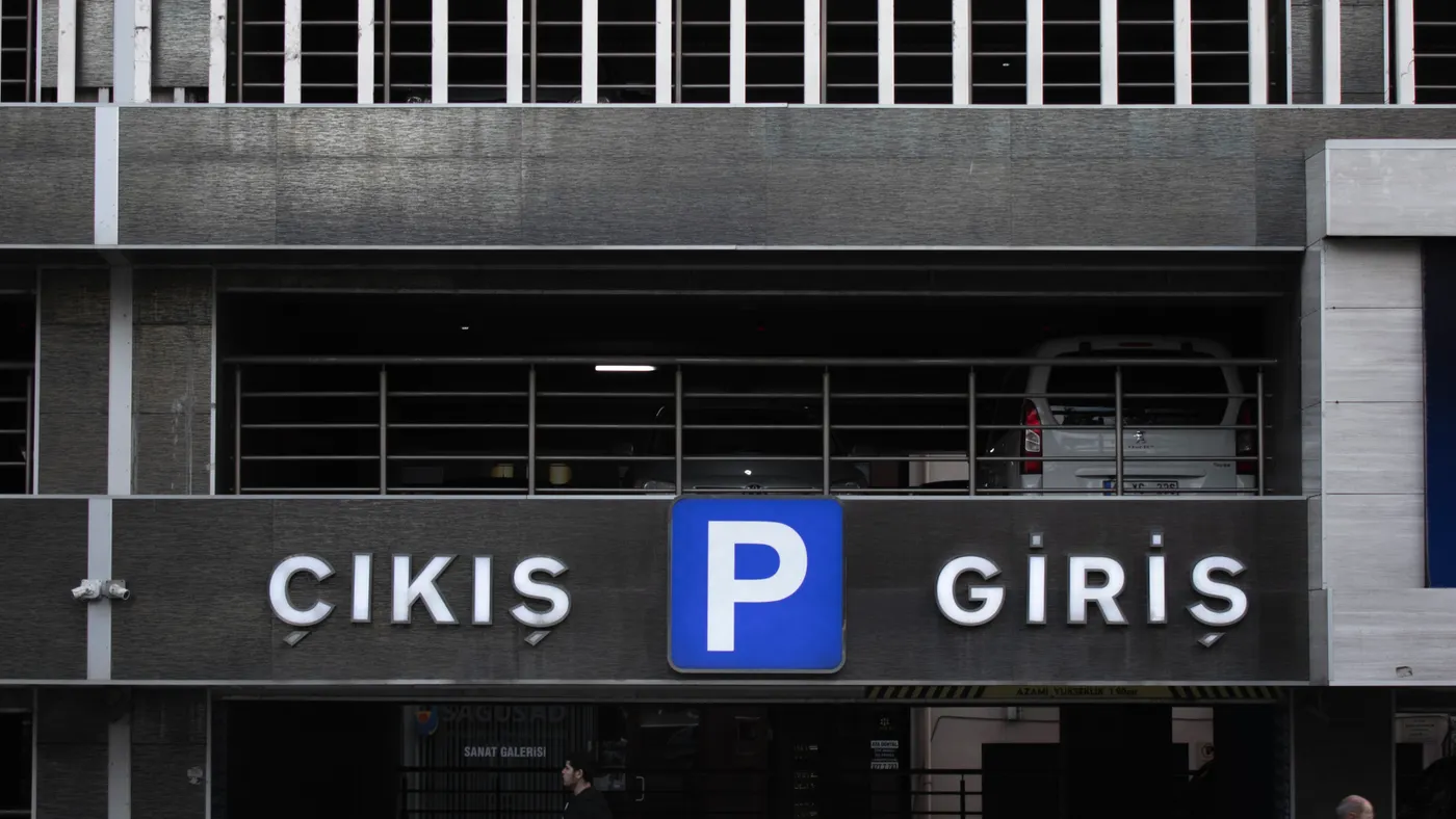 A real public car park entrance with Turkish entry and exit signs